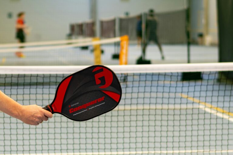 Pickleball players in action on a pickleball court